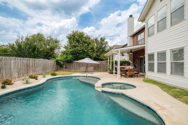 1511 Rhapsody Ridge Dr, Cedar Park, TX 78613 - view of swimming pool with a ceiling fan, a patio area, a fenced backyard, outdoor dining space, and a pool with connected hot tub