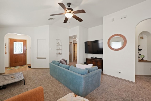 11012 Short Springs Dr, Austin, TX 78754 - living room with arched walkways, carpet floors, and ceiling fan
