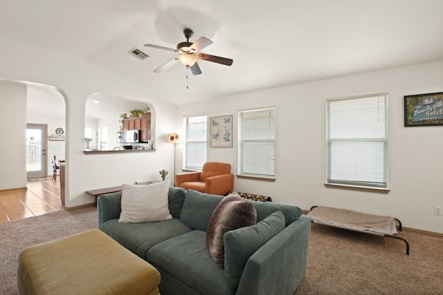 11012 Short Springs Dr, Austin, TX 78754 - living room with light colored carpet, ceiling fan, and vaulted ceiling