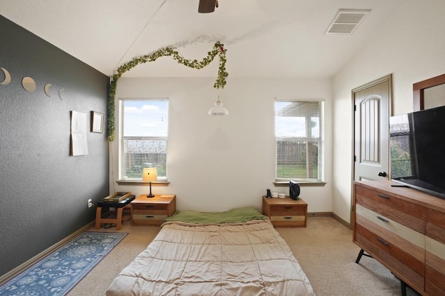 11012 Short Springs Dr, Austin, TX 78754 - bedroom with light colored carpet, multiple windows, a textured wall, and a ceiling fan