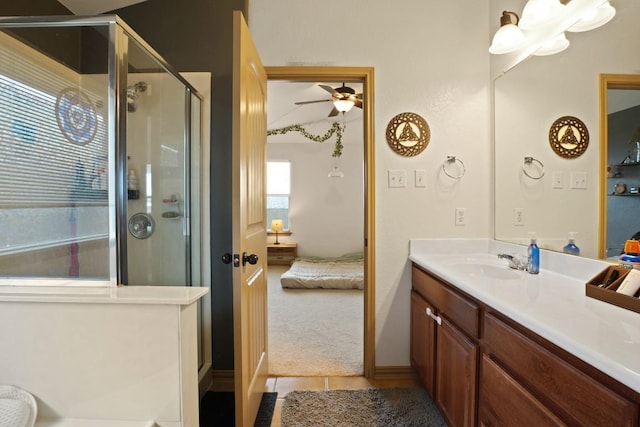 11012 Short Springs Dr, Austin, TX 78754 - ensuite bathroom with vanity, a shower stall, tile patterned flooring, and a ceiling fan