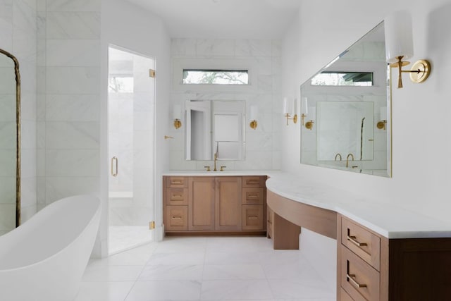 4100 Mcbrine Pl, Austin, TX 78746 - bathroom featuring a shower stall, a freestanding bath, marble finish floors, tile walls, and vanity