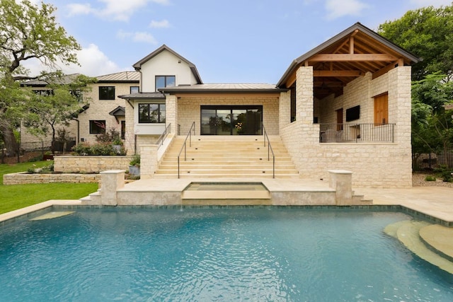 4100 Mcbrine Pl, Austin, TX 78746 - back of house featuring stairs, a standing seam roof, a metal roof, and an outdoor pool