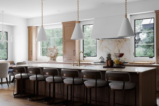 4100 Mcbrine Pl, Austin, TX 78746 - kitchen with custom range hood, tasteful backsplash, and plenty of natural light