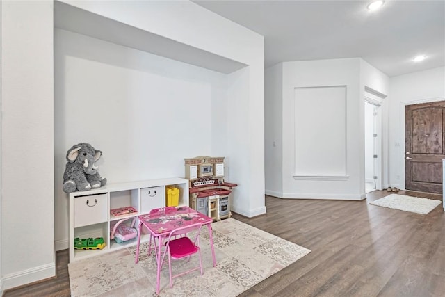 817 Clear Spring Ln, Leander, TX 78641 - playroom with dark wood-type flooring and recessed lighting