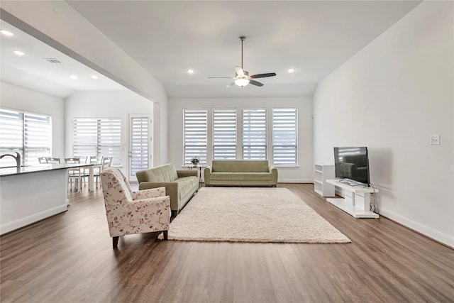 817 Clear Spring Ln, Leander, TX 78641 - living room with ceiling fan, wood finished floors, and recessed lighting