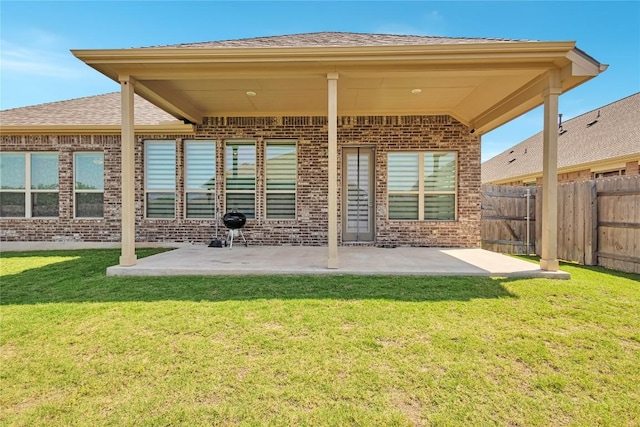 817 Clear Spring Ln, Leander, TX 78641 - back of house featuring brick siding, a patio area, and roof with shingles