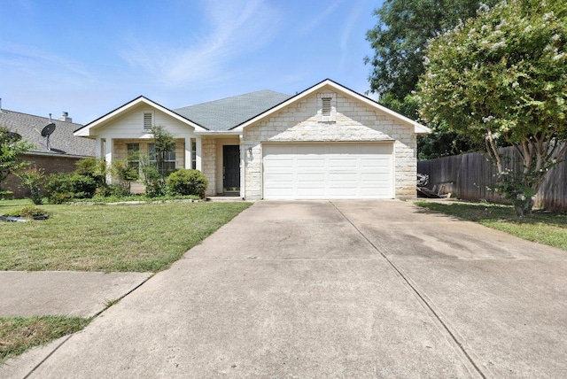 107 Chandler View Trl, Round Rock, TX 78665 - ranch-style house featuring driveway, a garage, stone siding, and a shingled roof