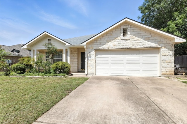 107 Chandler View Trl, Round Rock, TX 78665 - ranch-style home with driveway, a front yard, an attached garage, and stone siding