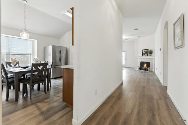 107 Chandler View Trl, Round Rock, TX 78665 - dining room featuring healthy amount of natural light, dark wood-style floors, and a tile fireplace