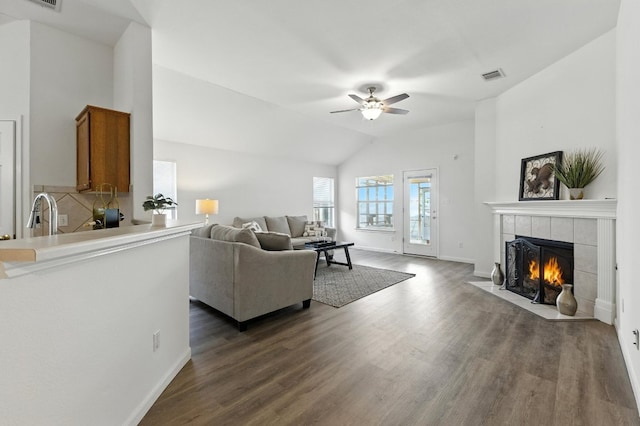 107 Chandler View Trl, Round Rock, TX 78665 - living area with ceiling fan, a tile fireplace, dark wood finished floors, and lofted ceiling