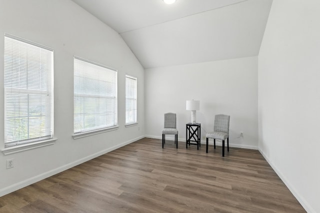 107 Chandler View Trl, Round Rock, TX 78665 - living area featuring healthy amount of natural light, lofted ceiling, and wood finished floors