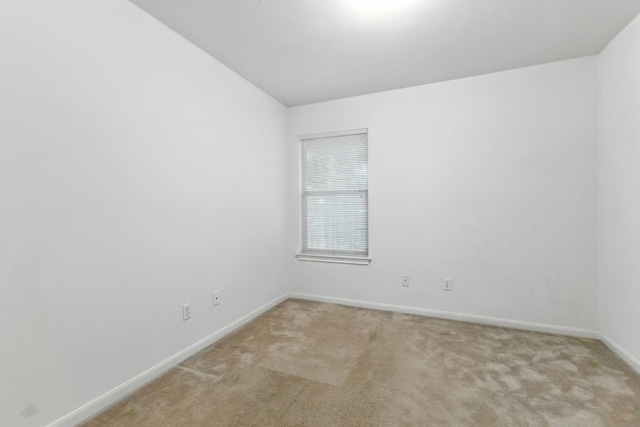 107 Chandler View Trl, Round Rock, TX 78665 - spare room featuring light carpet and vaulted ceiling