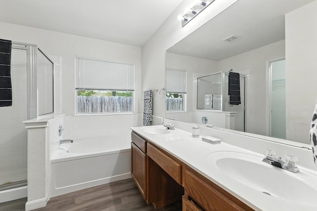 107 Chandler View Trl, Round Rock, TX 78665 - full bathroom with a shower stall, wood finished floors, and a bath