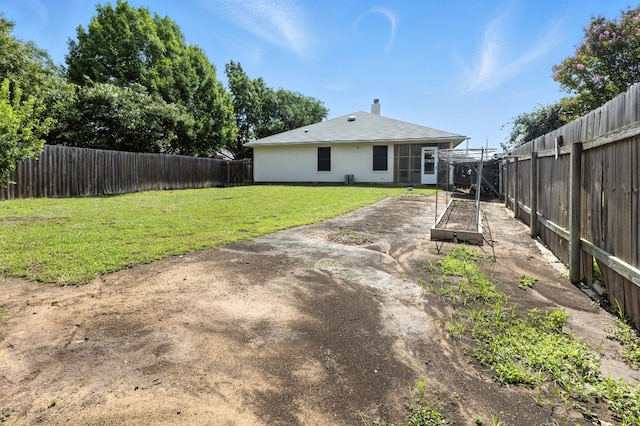 107 Chandler View Trl, Round Rock, TX 78665 - rear view of house featuring a fenced backyard, a chimney, and a patio
