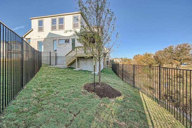 1531 N Red Bud Ln Unit 19, Round Rock, TX 78665 - rear view of house featuring a fenced backyard, stone siding, and stairway