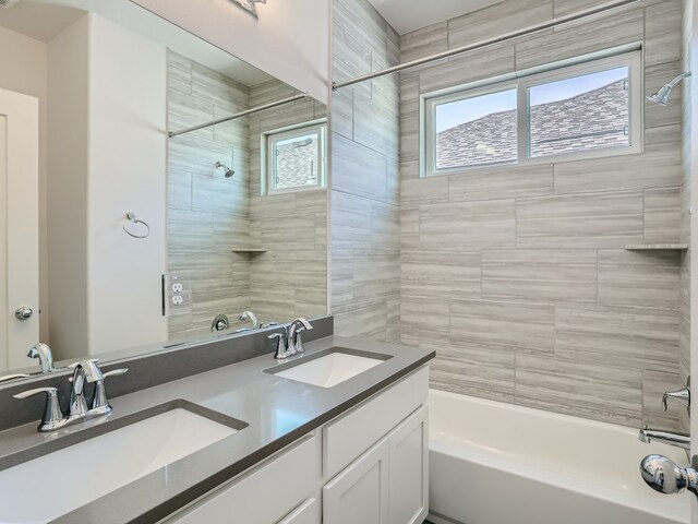 1531 N Red Bud Ln Unit 37, Round Rock, TX 78665 - bathroom featuring shower / washtub combination and double vanity