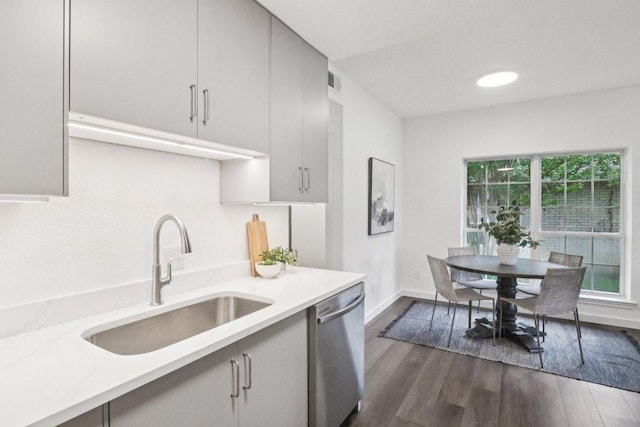 707 Mason St, Leander, TX 78641 - kitchen with dishwasher, light countertops, dark wood-style flooring, and gray cabinetry