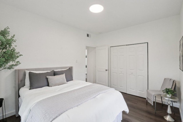 707 Mason St, Leander, TX 78641 - bedroom featuring dark wood finished floors and a closet