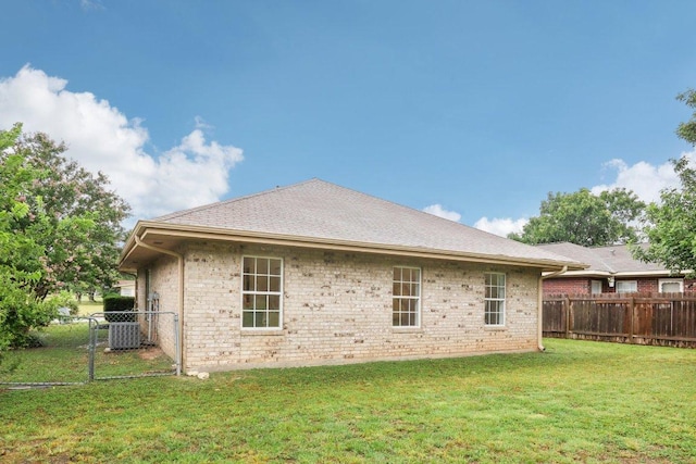 707 Mason St, Leander, TX 78641 - rear view of property with a fenced backyard and brick siding