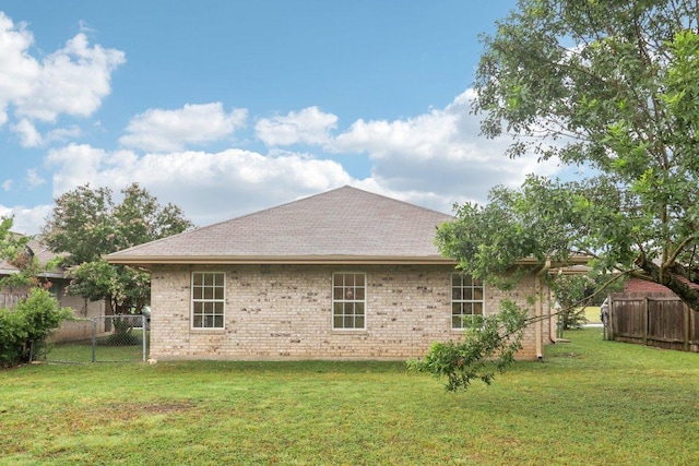 707 Mason St, Leander, TX 78641 - view of side of home featuring a shingled roof and brick siding