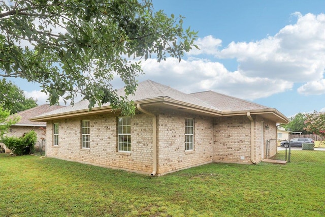 707 Mason St, Leander, TX 78641 - rear view of property with brick siding and roof with shingles
