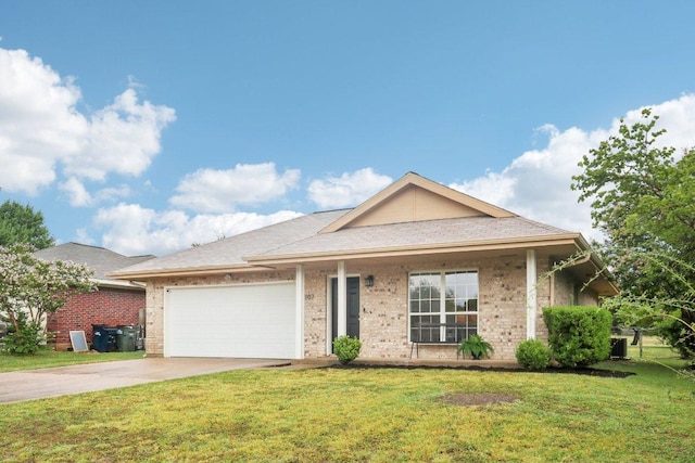 707 Mason St, Leander, TX 78641 - view of front of home featuring driveway, a front lawn, a garage, and brick siding