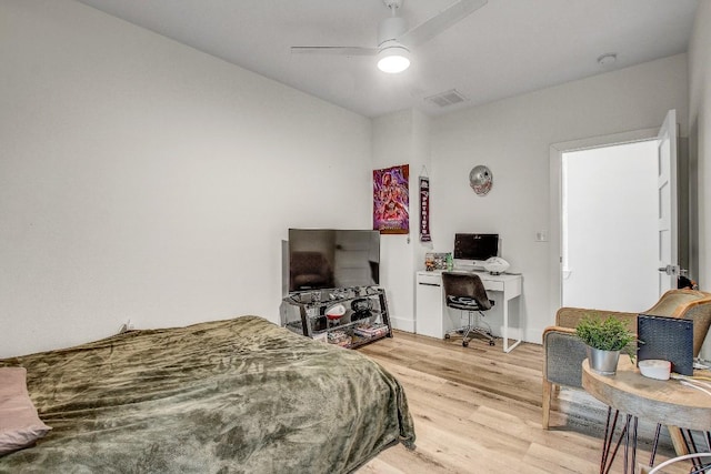 11300 Lake Dr, Austin, TX 78748 - bedroom with a desk, light wood-style flooring, and ceiling fan