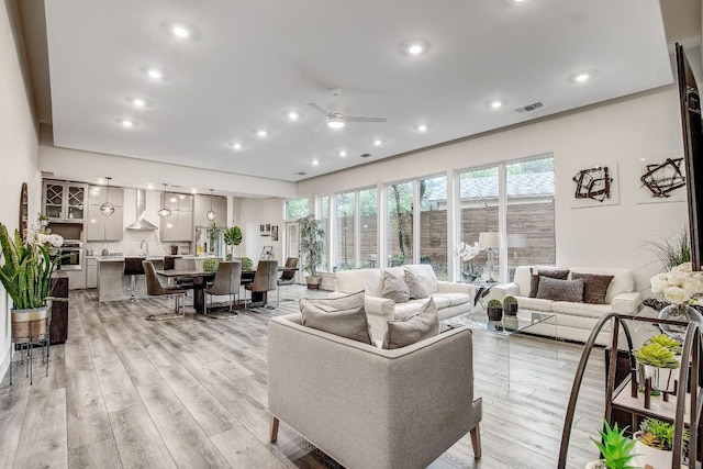 11300 Lake Dr, Austin, TX 78748 - living area with ceiling fan, light wood finished floors, and recessed lighting