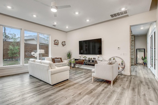 11300 Lake Dr, Austin, TX 78748 - living area with light wood-style flooring, ceiling fan, and recessed lighting