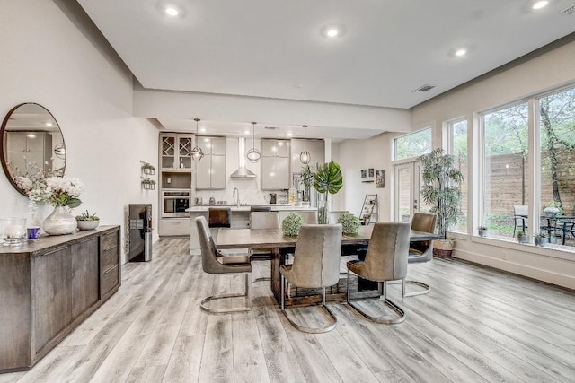11300 Lake Dr, Austin, TX 78748 - dining space with light wood-style floors and recessed lighting