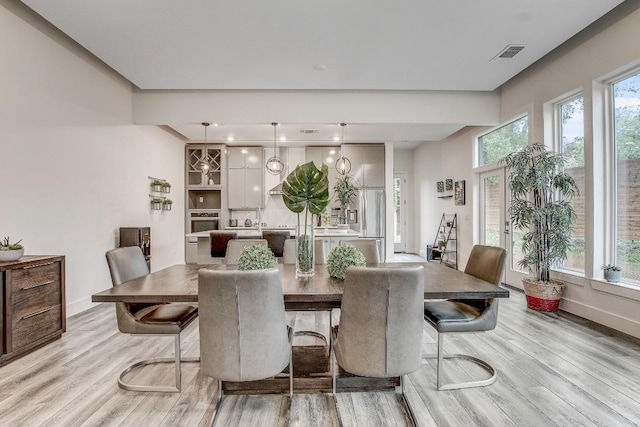 11300 Lake Dr, Austin, TX 78748 - dining area featuring light wood-style floors and recessed lighting