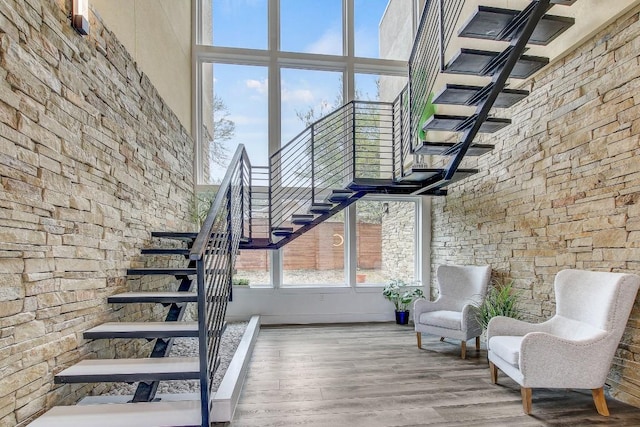 11300 Lake Dr, Austin, TX 78748 - staircase with a high ceiling and wood finished floors