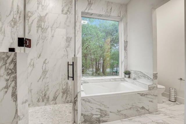 11300 Lake Dr, Austin, TX 78748 - bathroom with healthy amount of natural light, a marble finish shower, a bath, and marble tiled flooring