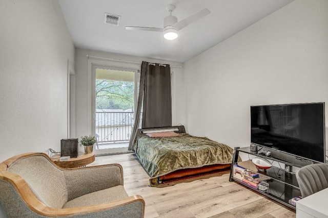 11300 Lake Dr, Austin, TX 78748 - bedroom featuring wood finished floors, vaulted ceiling, a ceiling fan, and access to exterior