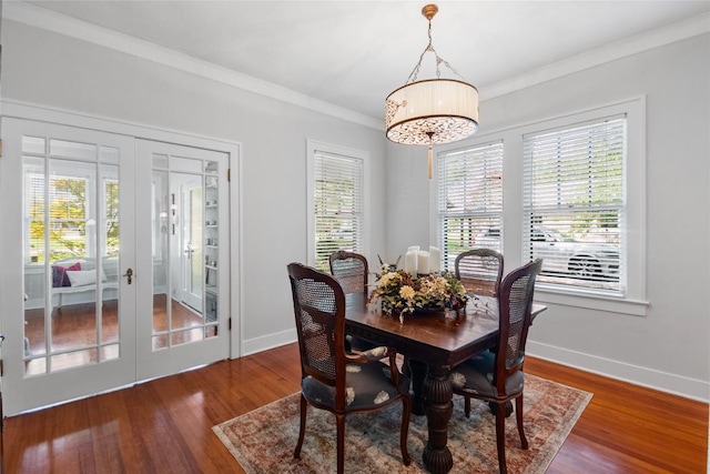 603 E Liberty Ave, Round Rock, TX 78664 - dining space with french doors, healthy amount of natural light, crown molding, and wood finished floors