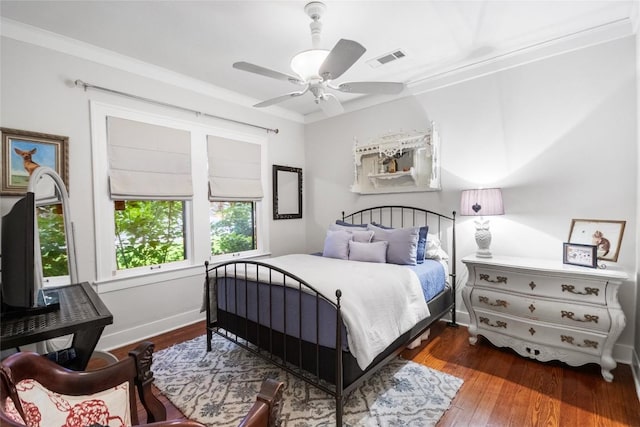 603 E Liberty Ave, Round Rock, TX 78664 - bedroom with wood finished floors, crown molding, and ceiling fan