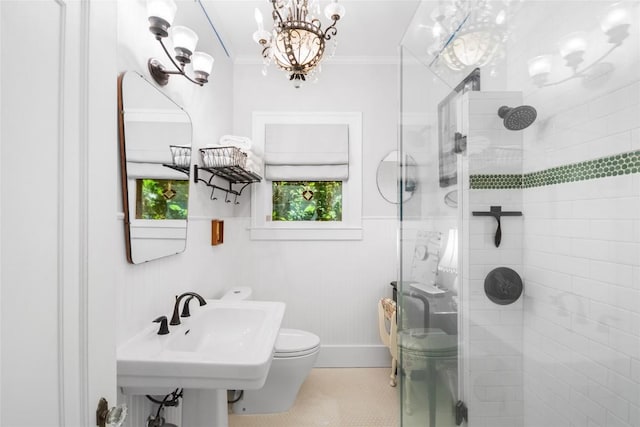 603 E Liberty Ave, Round Rock, TX 78664 - full bathroom with a shower stall, ornamental molding, a chandelier, and tile patterned floors