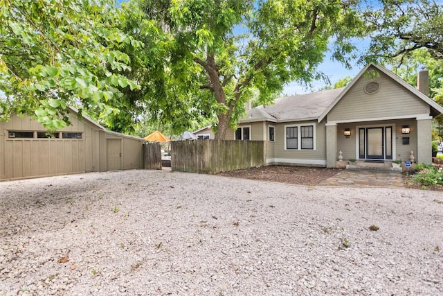 603 E Liberty Ave, Round Rock, TX 78664 - rear view of property with a chimney
