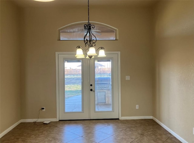 129 S Abrego Xing S, Floresville, TX 78114 - doorway to outside with a chandelier, tile patterned flooring, and french doors