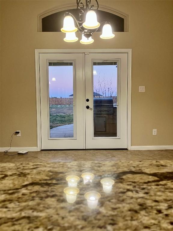 129 S Abrego Xing S, Floresville, TX 78114 - foyer with a chandelier and french doors