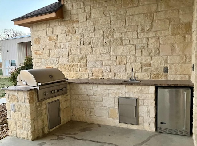 129 S Abrego Xing S, Floresville, TX 78114 - view of patio / terrace with a sink and area for grilling