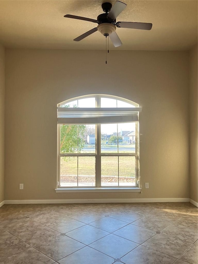 129 S Abrego Xing S, Floresville, TX 78114 - empty room featuring baseboards and ceiling fan