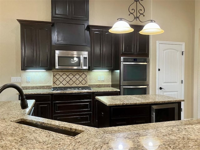 129 S Abrego Xing S, Floresville, TX 78114 - kitchen with stainless steel appliances, decorative backsplash, wine cooler, and light stone countertops