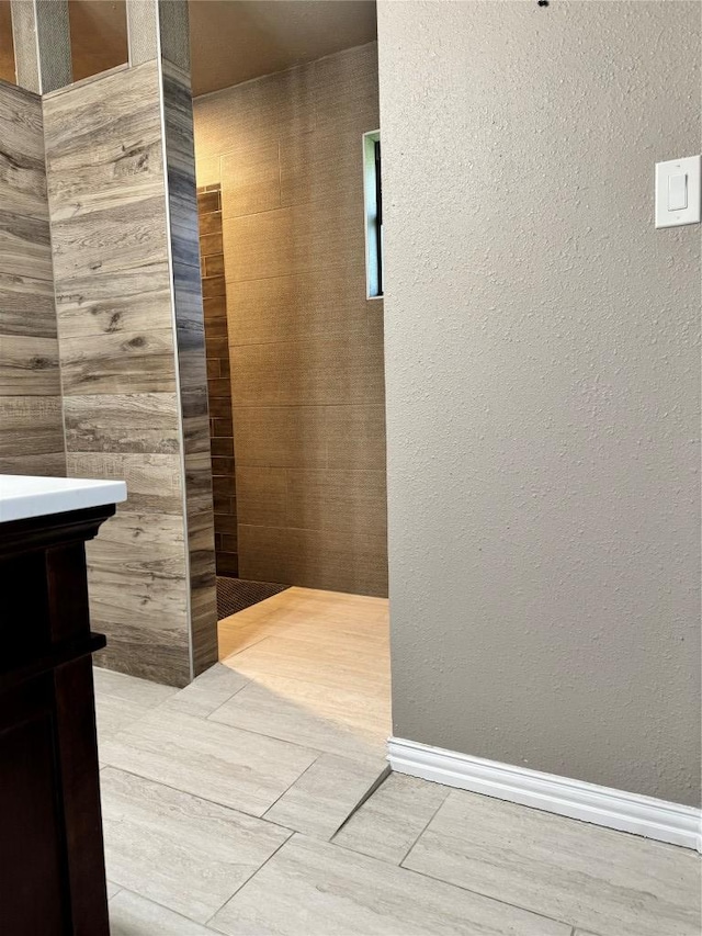 1000 Twin Creek Dr, Pflugerville, TX 78660 - bathroom featuring baseboards and a textured wall