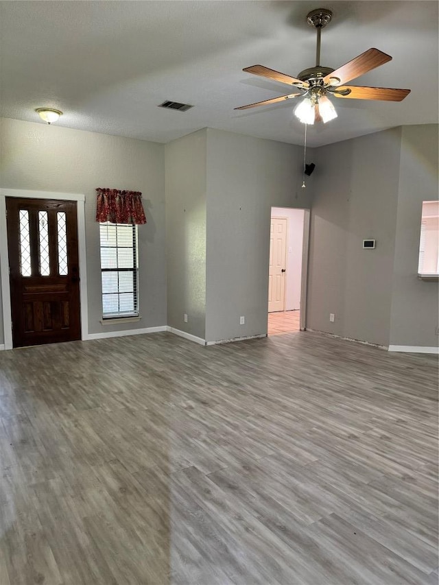 1000 Twin Creek Dr, Pflugerville, TX 78660 - unfurnished living room with wood finished floors and ceiling fan