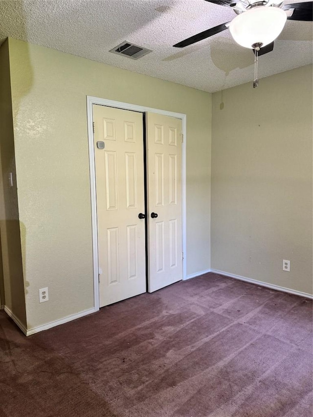 1000 Twin Creek Dr, Pflugerville, TX 78660 - unfurnished bedroom featuring carpet floors, a closet, ceiling fan, and a textured ceiling