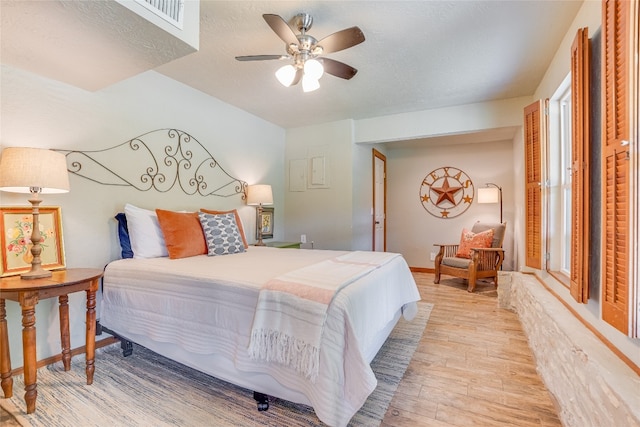 2308 Flite Acres Rd, Wimberley, TX 78676 - bedroom featuring light wood finished floors and a ceiling fan