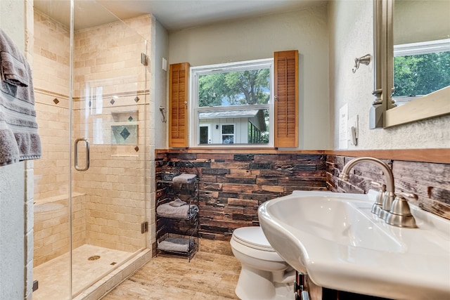 2308 Flite Acres Rd, Wimberley, TX 78676 - full bathroom with a stall shower, plenty of natural light, and wood finished floors