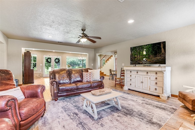 2308 Flite Acres Rd, Wimberley, TX 78676 - living room featuring a textured ceiling, stairway, ceiling fan, light wood finished floors, and recessed lighting